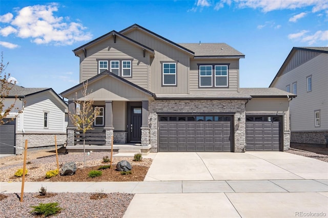 24563 E 34th Ave, Aurora, CO 80019 - craftsman-style home with a porch, concrete driveway, stone siding, and an attached garage
