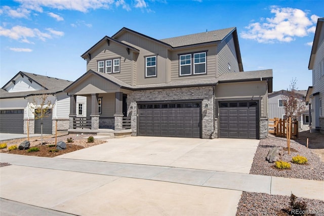 24563 E 34th Ave, Aurora, CO 80019 - craftsman house with a porch, stone siding, concrete driveway, and a garage
