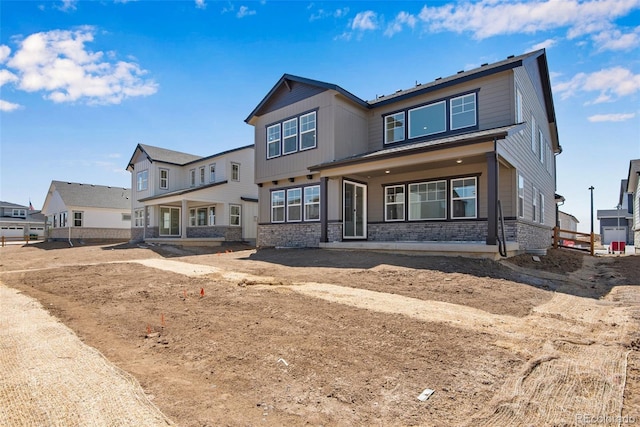 24563 E 34th Ave, Aurora, CO 80019 - view of front of home featuring covered porch and brick siding