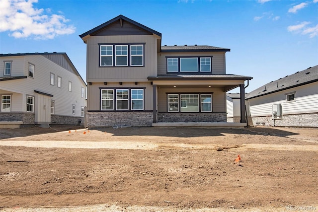 24563 E 34th Ave, Aurora, CO 80019 - view of front of property featuring stone siding and a porch