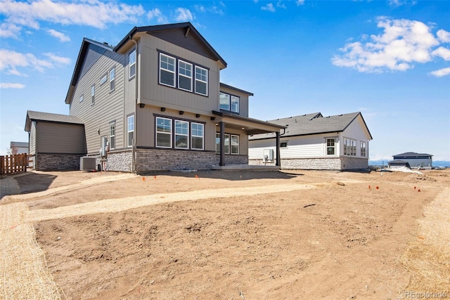 24563 E 34th Ave, Aurora, CO 80019 - craftsman-style house featuring stone siding, cooling unit, and fence