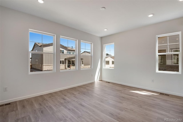 24563 E 34th Ave, Aurora, CO 80019 - spare room with light wood-style floors, baseboards, and recessed lighting