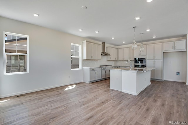 24563 E 34th Ave, Aurora, CO 80019 - kitchen with wall chimney range hood, recessed lighting, stainless steel gas stovetop, a sink, and backsplash