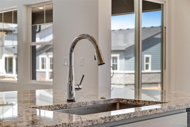 24563 E 34th Ave, Aurora, CO 80019 - kitchen view of a sink and light stone countertops