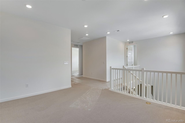 24563 E 34th Ave, Aurora, CO 80019 - spare room featuring light colored carpet, recessed lighting, and baseboards