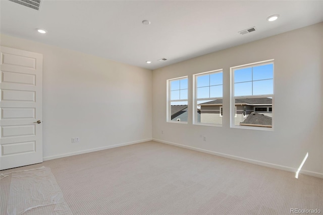 24563 E 34th Ave, Aurora, CO 80019 - spare room with light colored carpet, baseboards, and recessed lighting