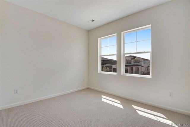 24563 E 34th Ave, Aurora, CO 80019 - carpeted spare room featuring baseboards