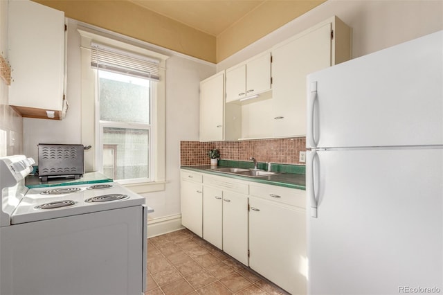 kitchen with sink, white cabinets, white appliances, and decorative backsplash