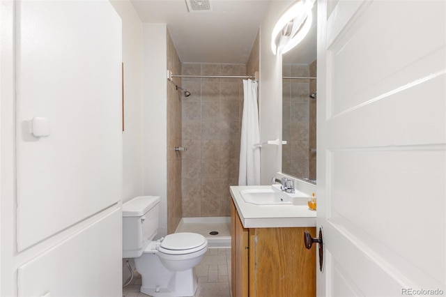 bathroom featuring vanity, a shower with shower curtain, and toilet