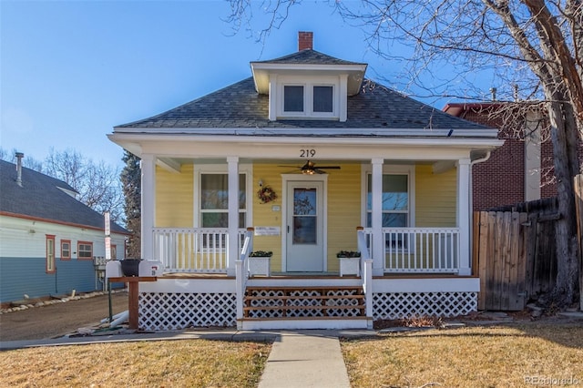 219 Terry St, Longmont, CO 80501 - view of front of home featuring covered porch, roof with shingles, a chimney, and a ceiling fan