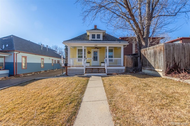 219 Terry St, Longmont, CO 80501 - bungalow-style home with covered porch and a chimney