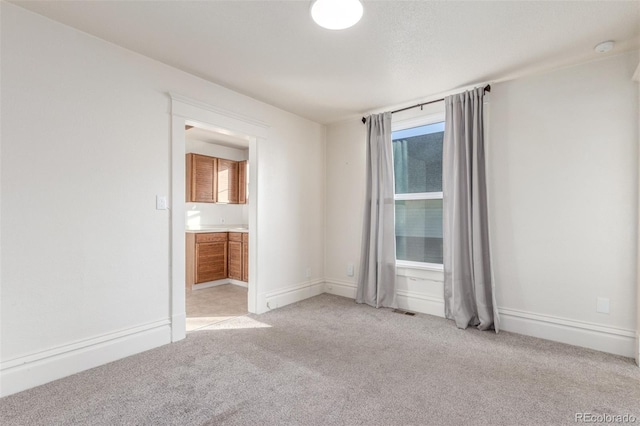 219 Terry St, Longmont, CO 80501 - empty room featuring light colored carpet and baseboards