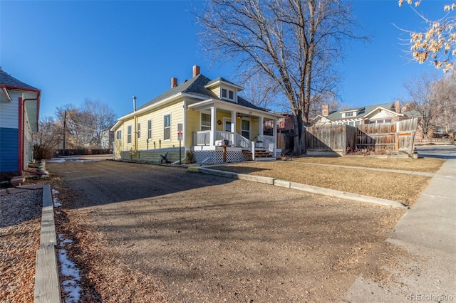 219 Terry St, Longmont, CO 80501 - view of front of home with covered porch and a chimney