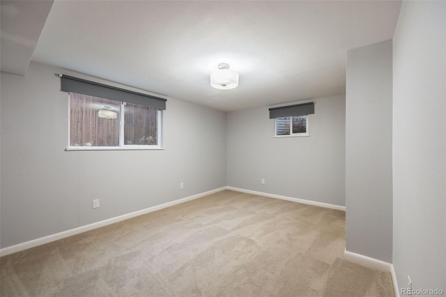 empty room featuring light colored carpet