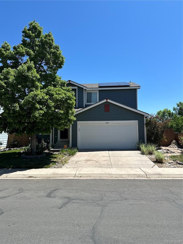 1086 Mockingbird St, Brighton, CO 80601 - traditional-style home featuring solar panels, a garage, and concrete driveway