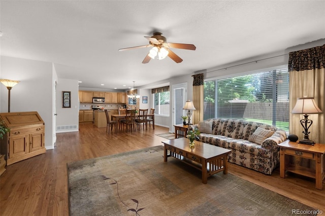 10643 Black Kettle Way, Colorado Springs, CO 80908 - living area with a ceiling fan and wood finished floors