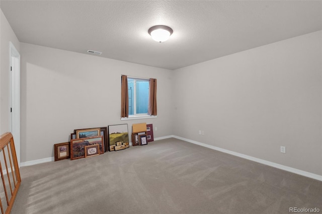 10643 Black Kettle Way, Colorado Springs, CO 80908 - carpeted empty room with baseboards and a textured ceiling