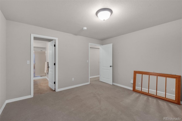 10643 Black Kettle Way, Colorado Springs, CO 80908 - unfurnished bedroom with carpet floors and a textured ceiling