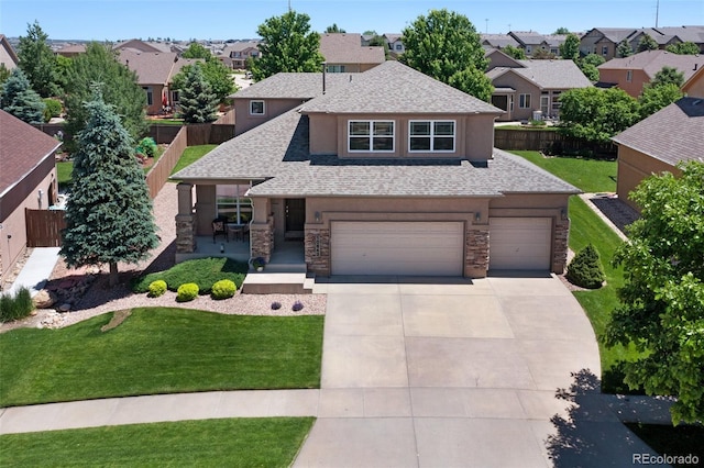10643 Black Kettle Way, Colorado Springs, CO 80908 - view of front of home featuring stone siding, a shingled roof, and a residential view