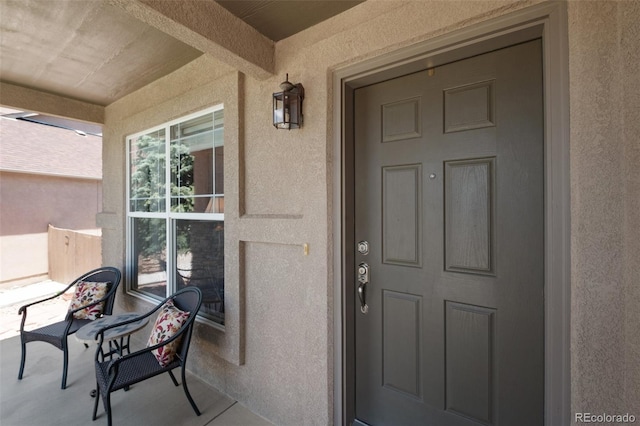 10643 Black Kettle Way, Colorado Springs, CO 80908 - view of exterior entry with stucco siding and covered porch