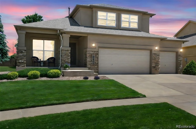 10643 Black Kettle Way, Colorado Springs, CO 80908 - prairie-style home featuring stone siding, stucco siding, concrete driveway, and a lawn