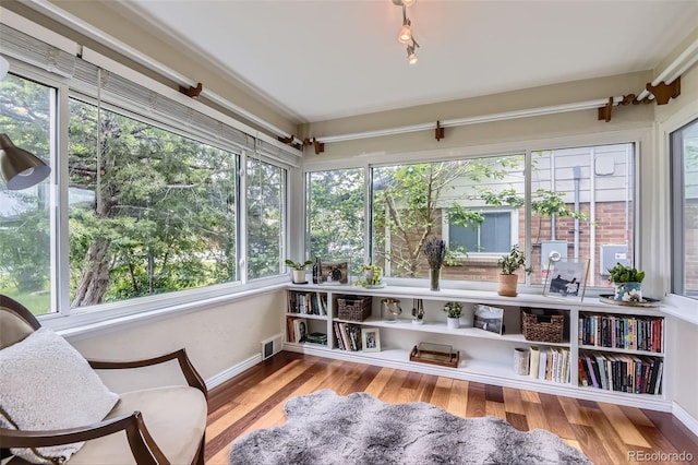 1697 W Powers Ave, Littleton, CO 80120 - sunroom with plenty of natural light, wood finished floors, and baseboards
