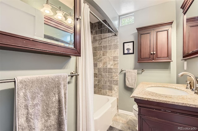 1697 W Powers Ave, Littleton, CO 80120 - full bath featuring vanity, shower / tub combo with curtain, baseboards, and toilet
