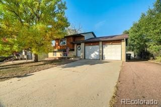 view of front of property with a garage