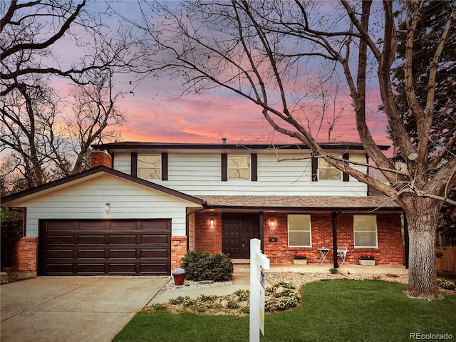8736 E Easter Ave, Centennial, CO 80112 - view of front of property featuring brick siding, concrete driveway, and an attached garage
