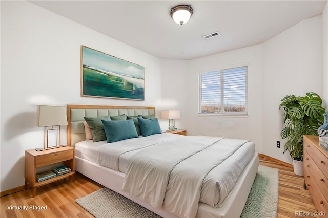 bedroom with light wood-type flooring