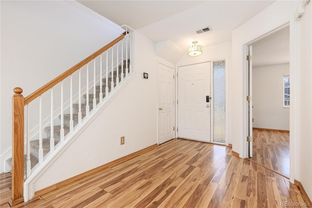 foyer entrance featuring wood-type flooring