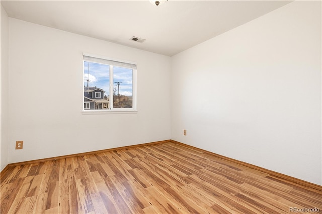 unfurnished room with light hardwood / wood-style flooring