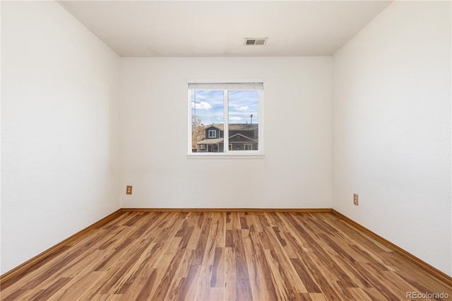 empty room featuring hardwood / wood-style flooring