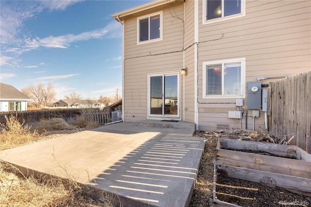 back of property with a patio