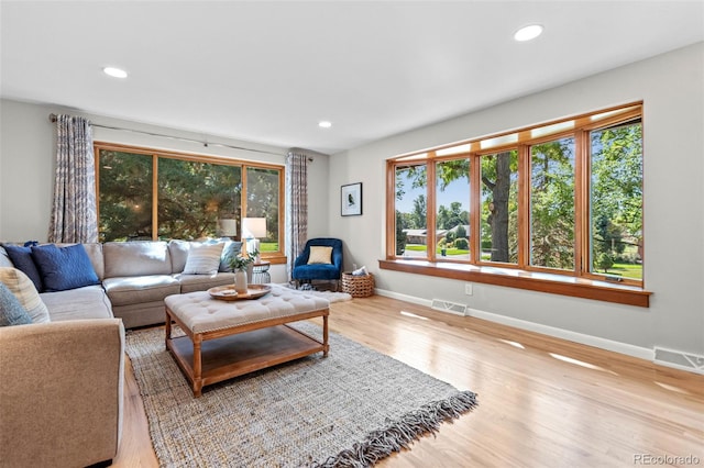 5465 W Ontario Ave, Littleton, CO 80128 - living area featuring wood finished floors and recessed lighting
