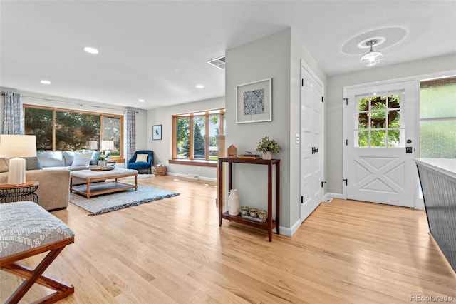 5465 W Ontario Ave, Littleton, CO 80128 - living area with light wood-style floors and recessed lighting