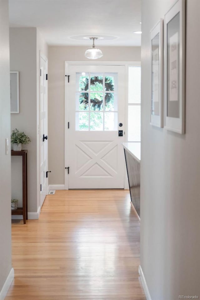 5465 W Ontario Ave, Littleton, CO 80128 - entryway featuring light wood-style floors