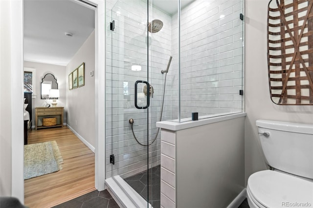5465 W Ontario Ave, Littleton, CO 80128 - bathroom with a stall shower and wood finished floors