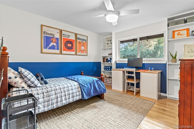 5465 W Ontario Ave, Littleton, CO 80128 - bedroom featuring wood finished floors, an office area, and a ceiling fan