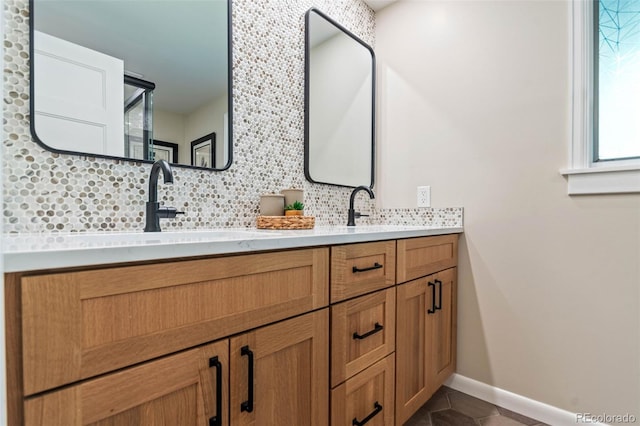5465 W Ontario Ave, Littleton, CO 80128 - full bath with backsplash, double vanity, and tile patterned flooring