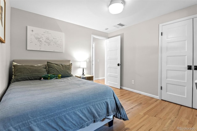 5465 W Ontario Ave, Littleton, CO 80128 - bedroom with light wood finished floors and baseboards