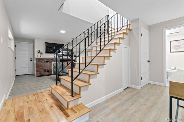 5465 W Ontario Ave, Littleton, CO 80128 - staircase featuring wood finished floors
