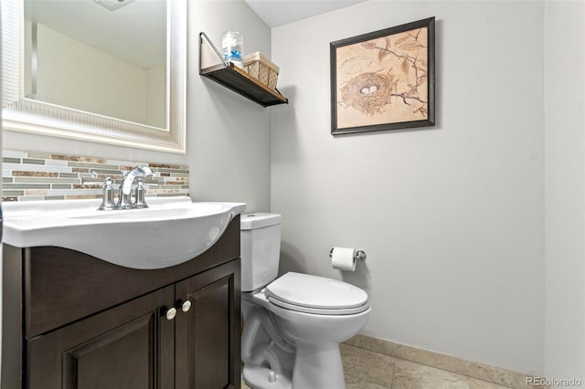 5465 W Ontario Ave, Littleton, CO 80128 - bathroom with vanity, decorative backsplash, and tile patterned floors