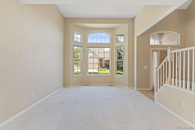 6449 S Jamaica Cir, Englewood, CO 80111 - carpeted foyer entrance featuring plenty of natural light and stairway