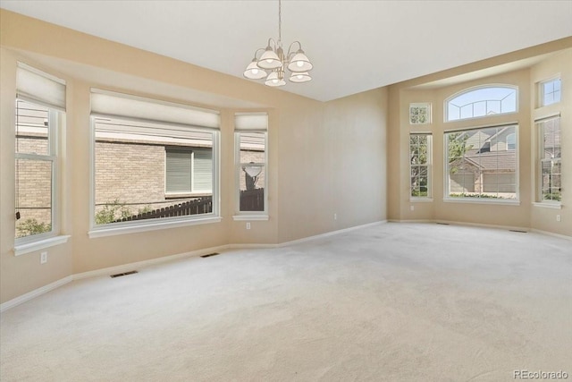 6449 S Jamaica Cir, Englewood, CO 80111 - empty room featuring a chandelier and carpet flooring