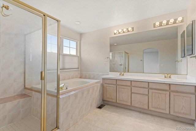 6449 S Jamaica Cir, Englewood, CO 80111 - bathroom with double vanity, a shower stall, tile patterned floors, and a garden tub