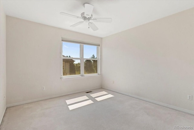 6449 S Jamaica Cir, Englewood, CO 80111 - carpeted spare room featuring baseboards and a ceiling fan