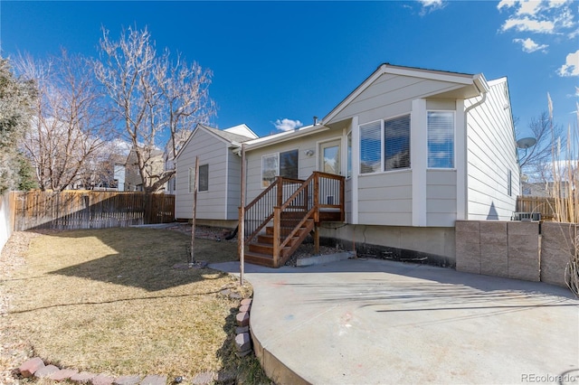 rear view of property with fence