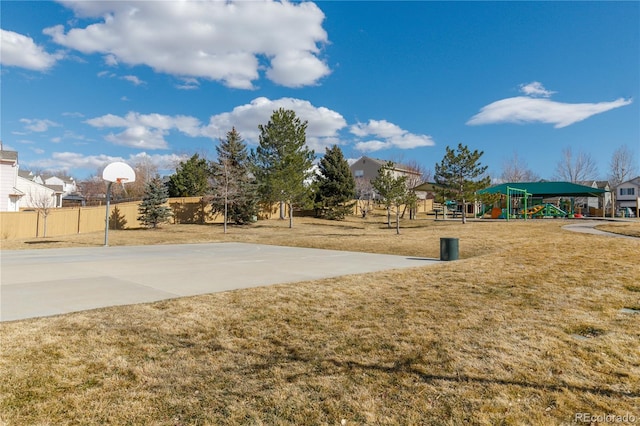 exterior space featuring playground community, fence, and community basketball court