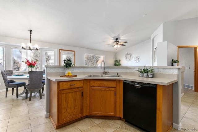 kitchen with black dishwasher, light tile patterned floors, light countertops, visible vents, and a sink